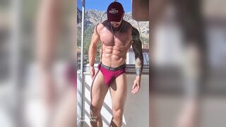 Muscled chap flexing and jerking